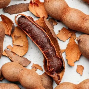 Dried Tamarind Pods - Naturally dried tamarind pods sourced from Nigeria, offering rich sour flavor for food processing, beverages, and export markets.